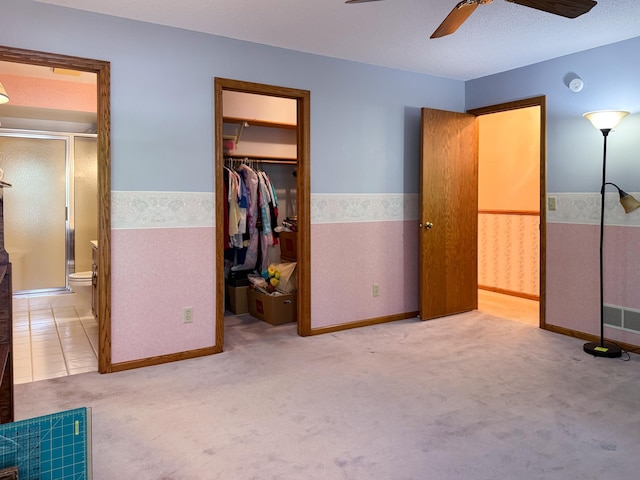 1626 Diane Rd, Mendota Heights, MN 55118 - unfurnished bedroom with a wainscoted wall, carpet, a walk in closet, connected bathroom, and a closet