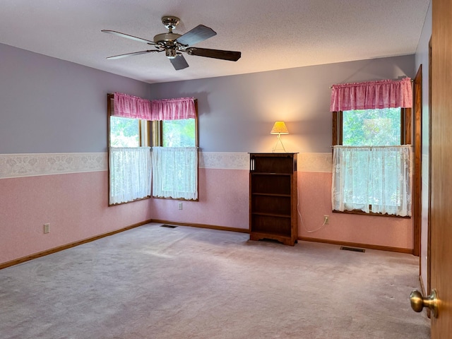 1626 Diane Rd, Mendota Heights, MN 55118 - carpeted empty room with ceiling fan, baseboards, and a textured ceiling