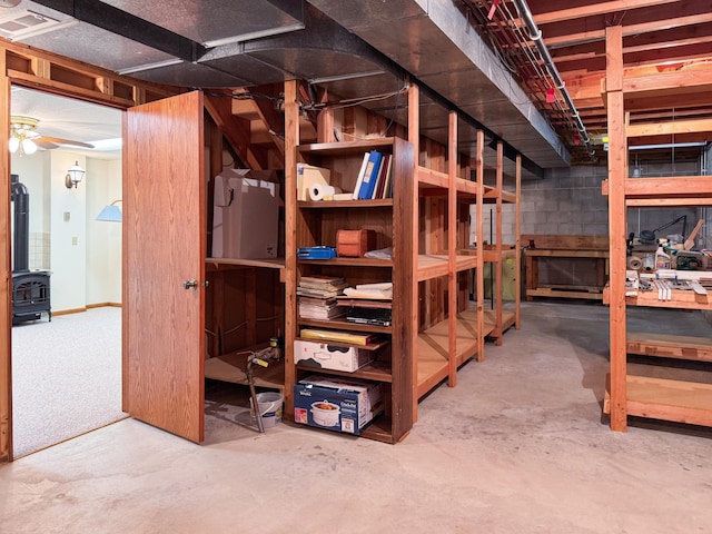 1626 Diane Rd, Mendota Heights, MN 55118 - unfinished below grade area with a wood stove