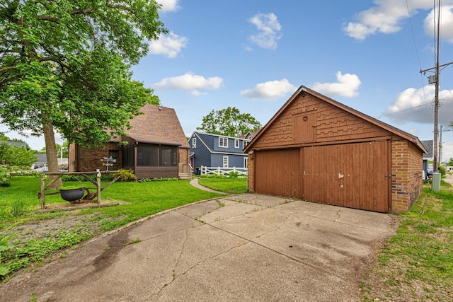 209 Main St, Arlington, MN 55307 - view of patio / terrace with a garage, a sunroom, and an outdoor structure
