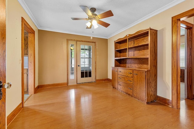 209 Main St, Arlington, MN 55307 - empty room featuring light wood-type flooring, a ceiling fan, baseboards, and ornamental molding