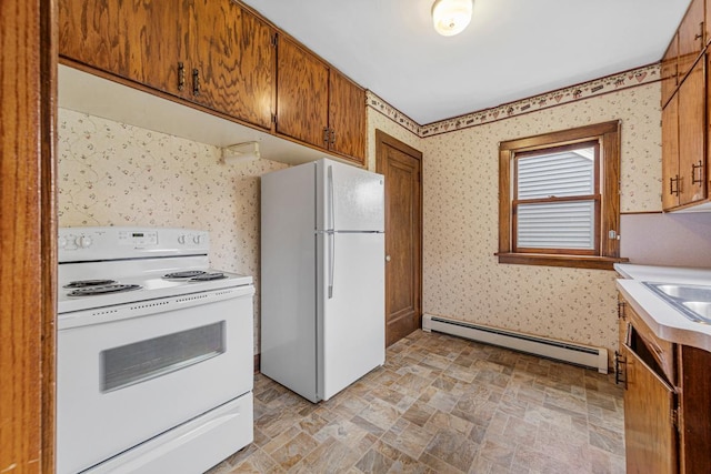 209 Main St, Arlington, MN 55307 - kitchen featuring white appliances, a baseboard heating unit, stone finish floors, wallpapered walls, and light countertops