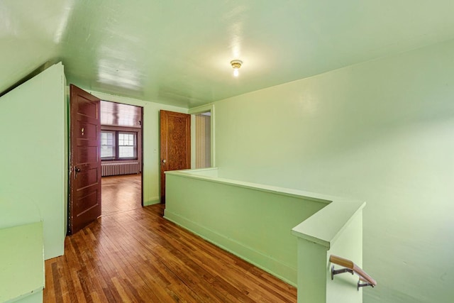 209 Main St, Arlington, MN 55307 - corridor with radiator, hardwood / wood-style flooring, and baseboards