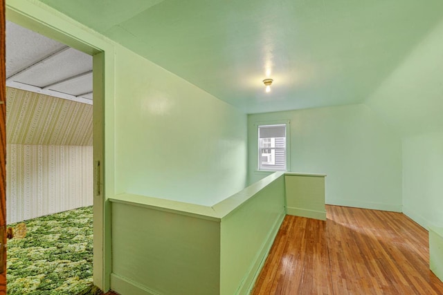 209 Main St, Arlington, MN 55307 - additional living space featuring wallpapered walls, wood-type flooring, and baseboards