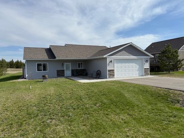 2008 Whiting Rd NW Unit 26, Bemidji, MN 56601 - single story home with driveway, an attached garage, a front lawn, and stone siding