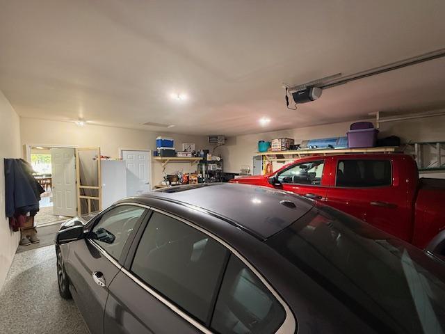 2008 Whiting Rd NW Unit 26, Bemidji, MN 56601 - garage with a garage door opener