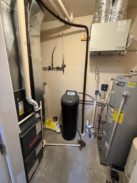 2008 Whiting Rd NW Unit 26, Bemidji, MN 56601 - utility room featuring water heater and heating unit