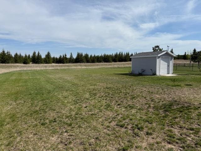 2008 Whiting Rd NW Unit 26, Bemidji, MN 56601 - view of grassy yard featuring an outdoor structure and a rural view