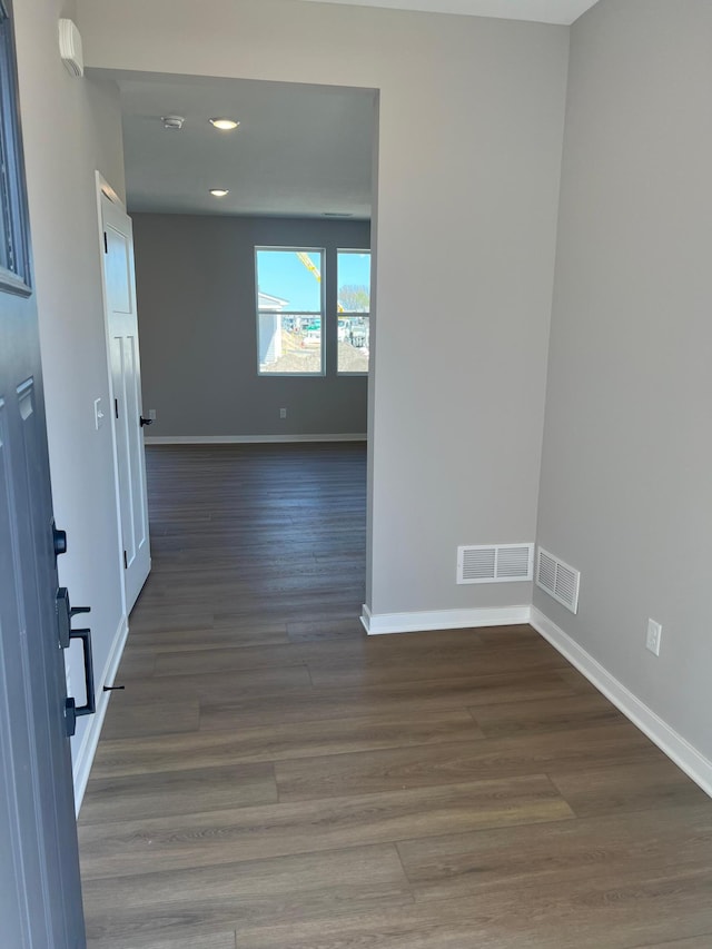 12608 Erskin St NE, Blaine, MN 55449 - spare room featuring baseboards, wood finished floors, and recessed lighting