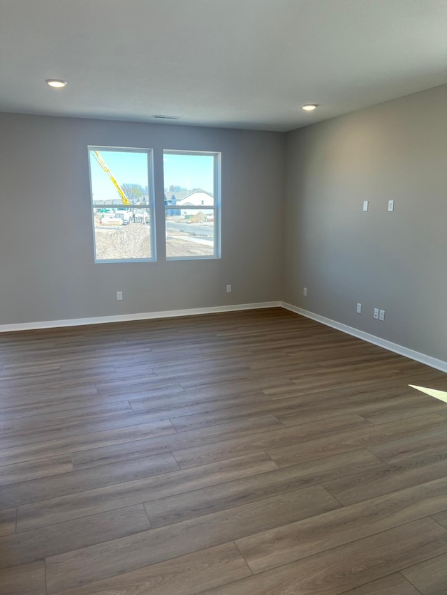 12608 Erskin St NE, Blaine, MN 55449 - spare room featuring wood finished floors, recessed lighting, and baseboards