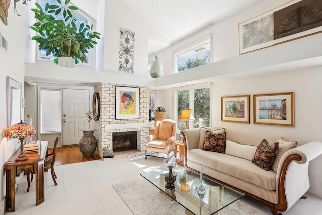 7676 Woodview Ct, Edina, MN 55439 - living area featuring a high ceiling and a fireplace