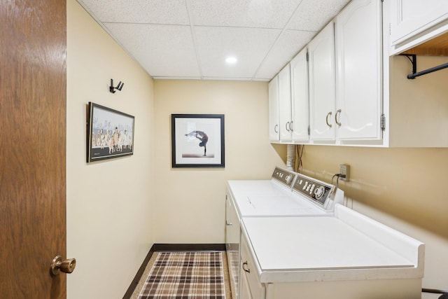 7676 Woodview Ct, Edina, MN 55439 - washroom with washing machine and dryer, cabinet space, baseboards, and recessed lighting