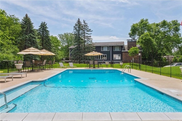 7676 Woodview Ct, Edina, MN 55439 - community pool featuring a patio area and fence