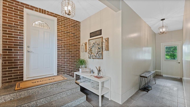 12586 220th St, Silver Lake, MN 55381 - tiled entrance foyer featuring a chandelier and brick wall