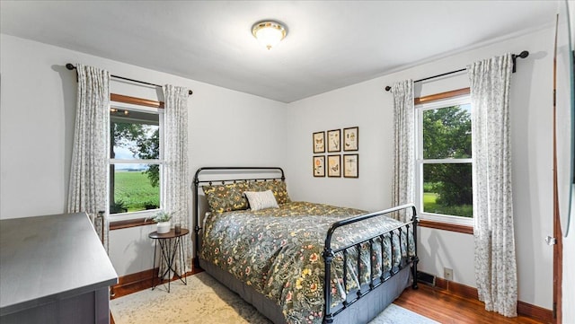 12586 220th St, Silver Lake, MN 55381 - bedroom with wood finished floors and baseboards