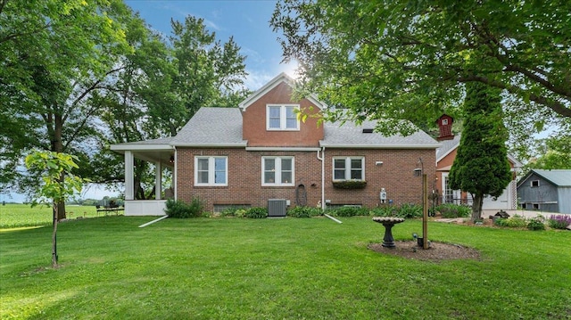12586 220th St, Silver Lake, MN 55381 - rear view of house with a yard and brick siding