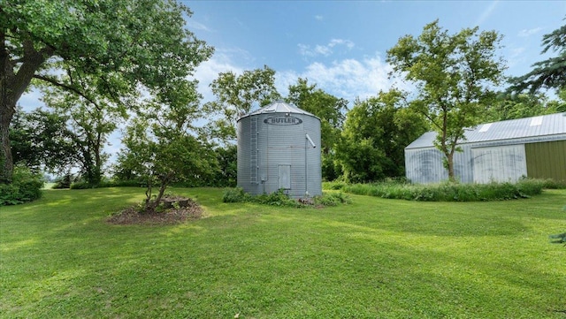 12586 220th St, Silver Lake, MN 55381 - view of green lawn with an outdoor structure and a pole building