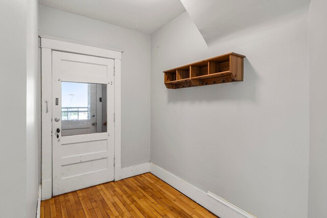 1123 5th St NE, Minneapolis, MN 55413 - doorway with light wood-style flooring and baseboards