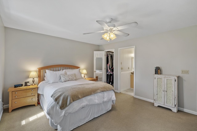 19062 180th Ave NW, Big Lake, MN 55309 - bedroom with a walk in closet, a closet, baseboards, and light carpet