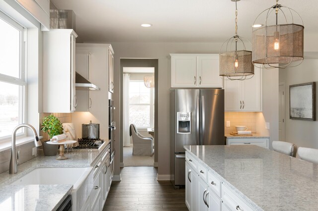 19530 102nd, Corcoran, MN 55374 - kitchen featuring stainless steel appliances, a sink, under cabinet range hood, white cabinetry, and dark wood-style flooring