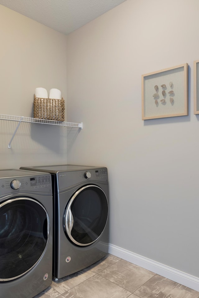 19530 102nd, Corcoran, MN 55374 - laundry room featuring washing machine and dryer and baseboards