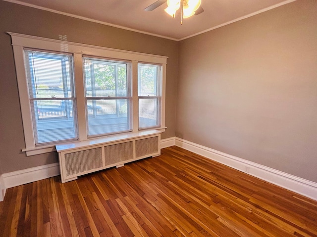 1536 Concordia Ave, Saint Paul, MN 55104 - unfurnished room with radiator heating unit, baseboards, wood finished floors, ceiling fan, and crown molding