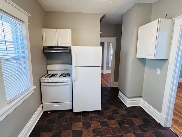 1536 Concordia Ave, Saint Paul, MN 55104 - kitchen with white appliances, range hood, baseboards, and healthy amount of natural light