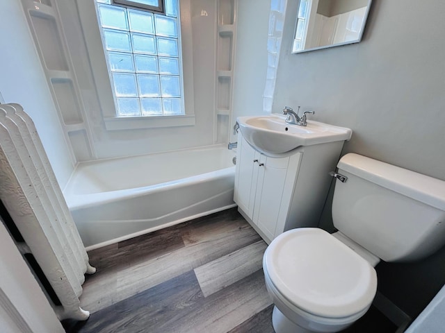 1536 Concordia Ave, Saint Paul, MN 55104 - full bathroom featuring toilet, wood finished floors, vanity, and shower / bath combination