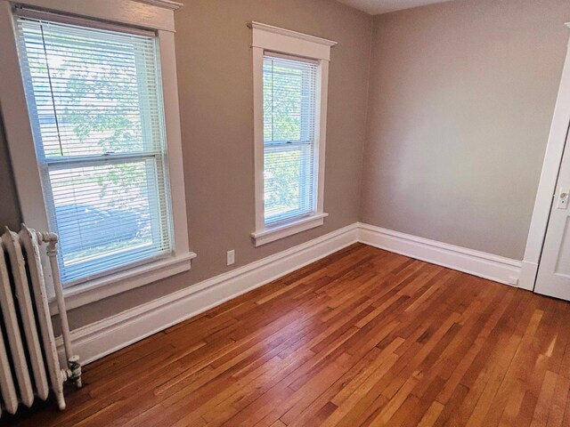 1536 Concordia Ave, Saint Paul, MN 55104 - unfurnished room featuring wood finished floors and baseboards