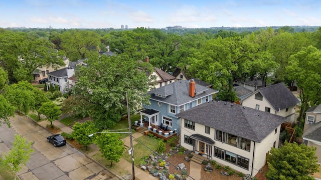 aerial view of residential area with a heavily wooded area