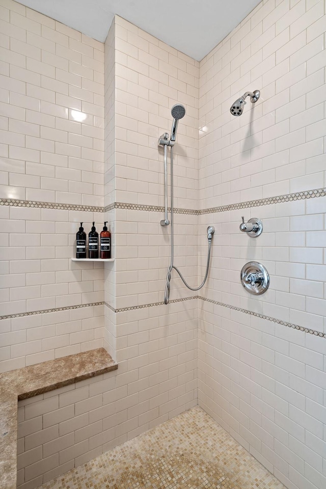 bathroom featuring tiled shower