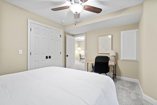 carpeted bedroom featuring baseboards, a closet, and ceiling fan