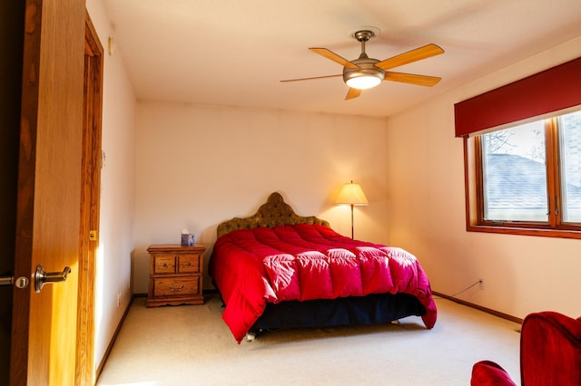 bedroom featuring carpet flooring, a ceiling fan, and baseboards