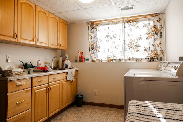 laundry area featuring washer and clothes dryer and cabinet space