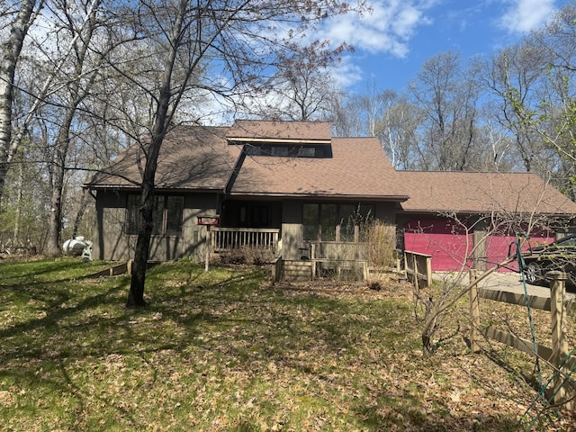7525 Filbert Ln NE, Turtle River Twp, MN 56601 - rear view of property featuring a yard, a shingled roof, covered porch, and board and batten siding