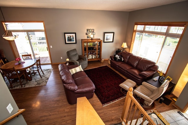 living area featuring wood finished floors and baseboards