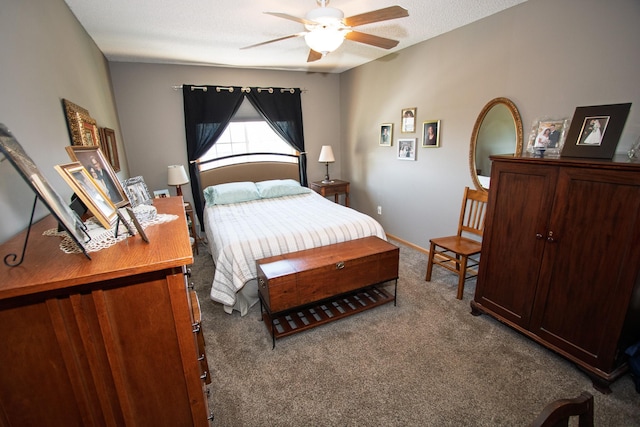 carpeted bedroom with baseboards and ceiling fan