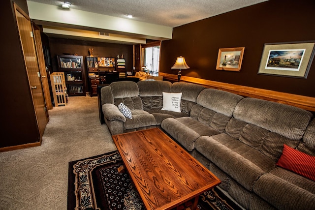 living room featuring carpet flooring and a textured ceiling