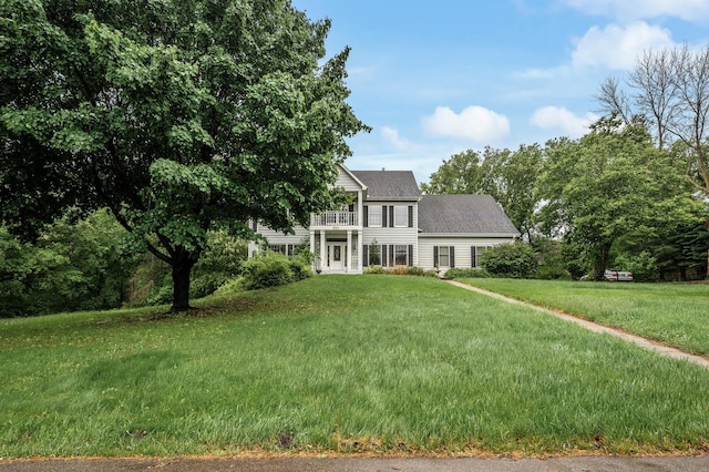 2401 Omeara Ct, Burnsville, MN 55306 - view of front facade featuring a balcony, a front lawn, and roof with shingles
