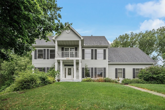2401 Omeara Ct, Burnsville, MN 55306 - view of front of home featuring a balcony, a front lawn, and a shingled roof