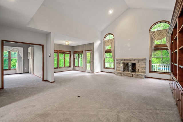 2401 Omeara Ct, Burnsville, MN 55306 - unfurnished living room featuring baseboards, high vaulted ceiling, carpet, a stone fireplace, and recessed lighting