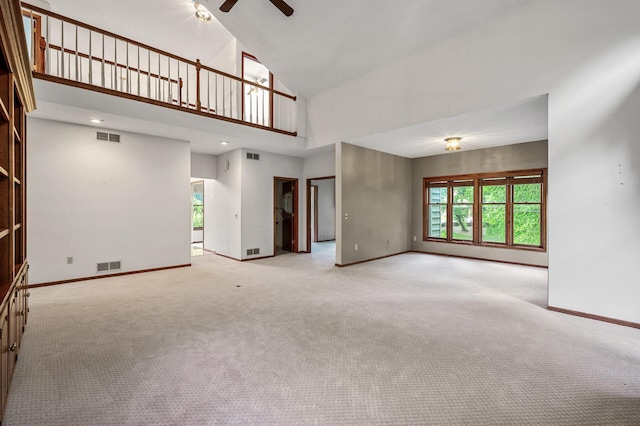 2401 Omeara Ct, Burnsville, MN 55306 - unfurnished living room featuring high vaulted ceiling, a ceiling fan, baseboards, and carpet flooring