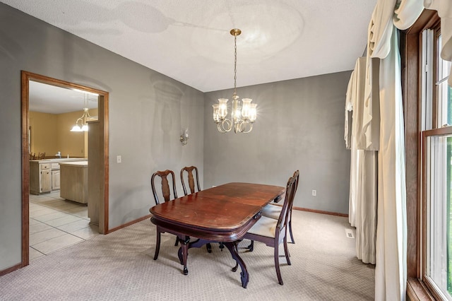2401 Omeara Ct, Burnsville, MN 55306 - dining room with light carpet, a chandelier, and baseboards