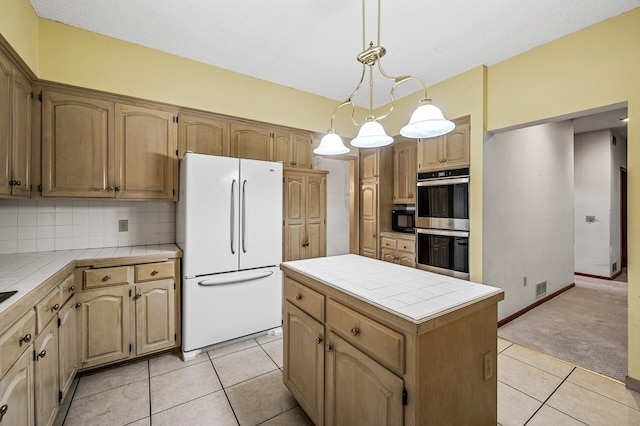 2401 Omeara Ct, Burnsville, MN 55306 - kitchen with freestanding refrigerator, tile counters, stainless steel double oven, a kitchen island, and light tile patterned flooring
