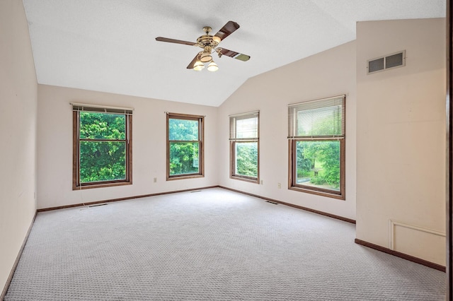 2401 Omeara Ct, Burnsville, MN 55306 - carpeted spare room featuring lofted ceiling, healthy amount of natural light, baseboards, and a ceiling fan