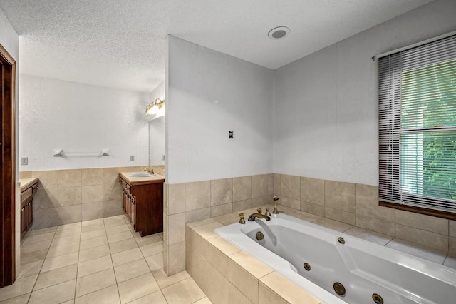 2401 Omeara Ct, Burnsville, MN 55306 - bathroom with vanity, a tub with jets, tile patterned floors, healthy amount of natural light, and tile walls