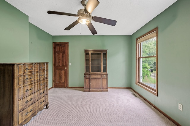 2401 Omeara Ct, Burnsville, MN 55306 - unfurnished bedroom with baseboards, carpet, and a ceiling fan