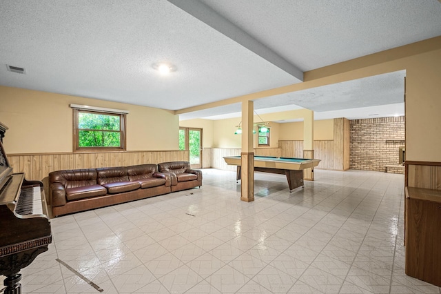 2401 Omeara Ct, Burnsville, MN 55306 - living room with wainscoting, a textured ceiling, billiards table, and wood walls