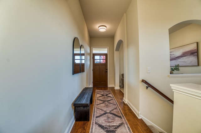 17796 Junelle Ct, Lakeville, MN 55044 - doorway featuring dark wood-type flooring, baseboards, and arched walkways