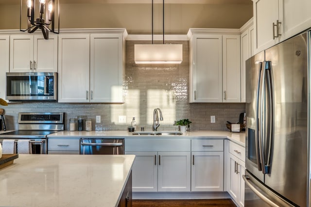 17796 Junelle Ct, Lakeville, MN 55044 - kitchen with stainless steel appliances, a sink, backsplash, and white cabinetry